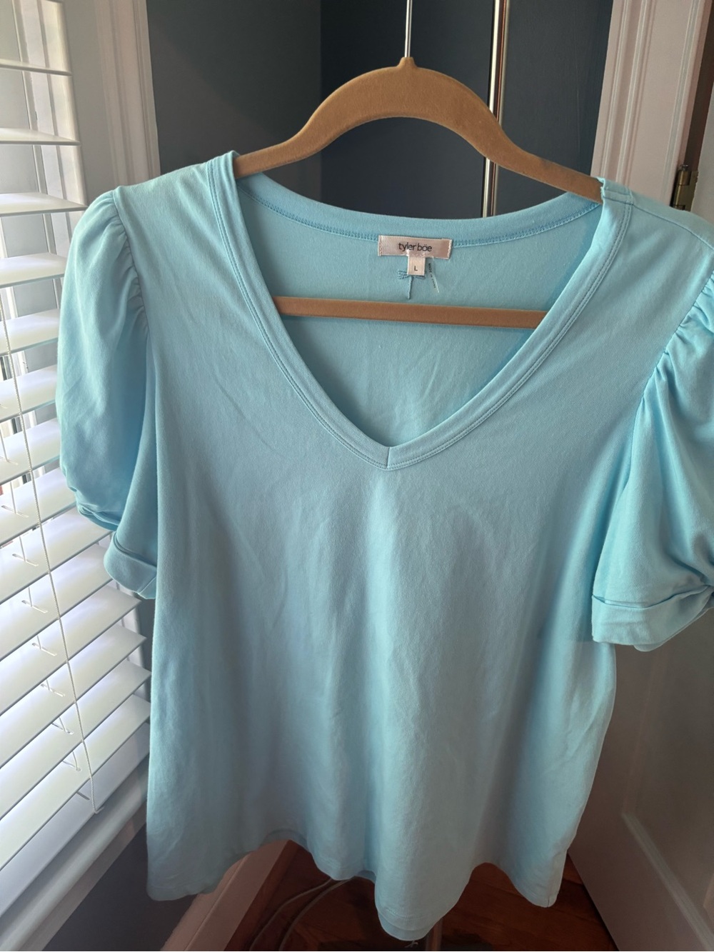 Tyler Boe size large 
Blue knit with puff sleeves